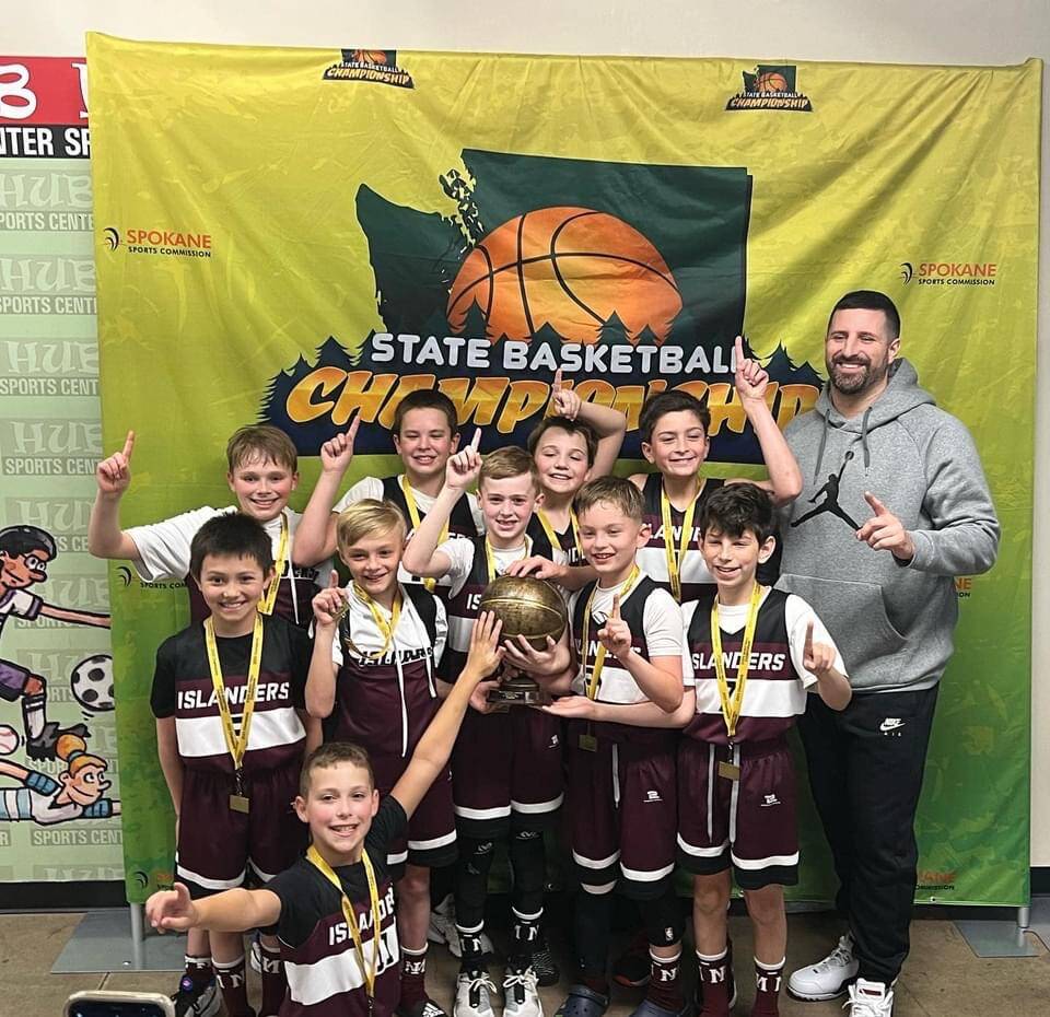 The fourth-grade Mercer Island Select Boys Basketball squad notched the state title in the silver division at the Washington Middle School Basketball Championship on March 20 in Spokane. The team is: kneeling, Drew Munson; front row, left to right, Cal Robinson, Luke Thomas, Paxton Conklin, Cash Coochise and Zachary Ashberg; and back row, left to right, Jacob Sharpe, Colton Gribble, Will Russell, Laign Magee and coach Tony Locascio. Not pictured: Johnny Banchero. Coach Locascios squad compiled a 4-0 record, including a 35-21 victory over Enumclaw in the final. The boys also defeated Woodland, 41-23, in the semifinals, Cashmere, 39-23, in the quarterfinals and Inglemoor, 41-15, in the opener. Mercer Island teams in grades 4-8 competed at the tournament from March 18-20 and amassed a 13-7 total record. Courtesy photo