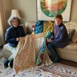 Bonnie Cundiff, right, and her daughter-in-law Kelly Cundiff check out curtains people have made and contributed to be placed in tiny homes. Courtesy photo