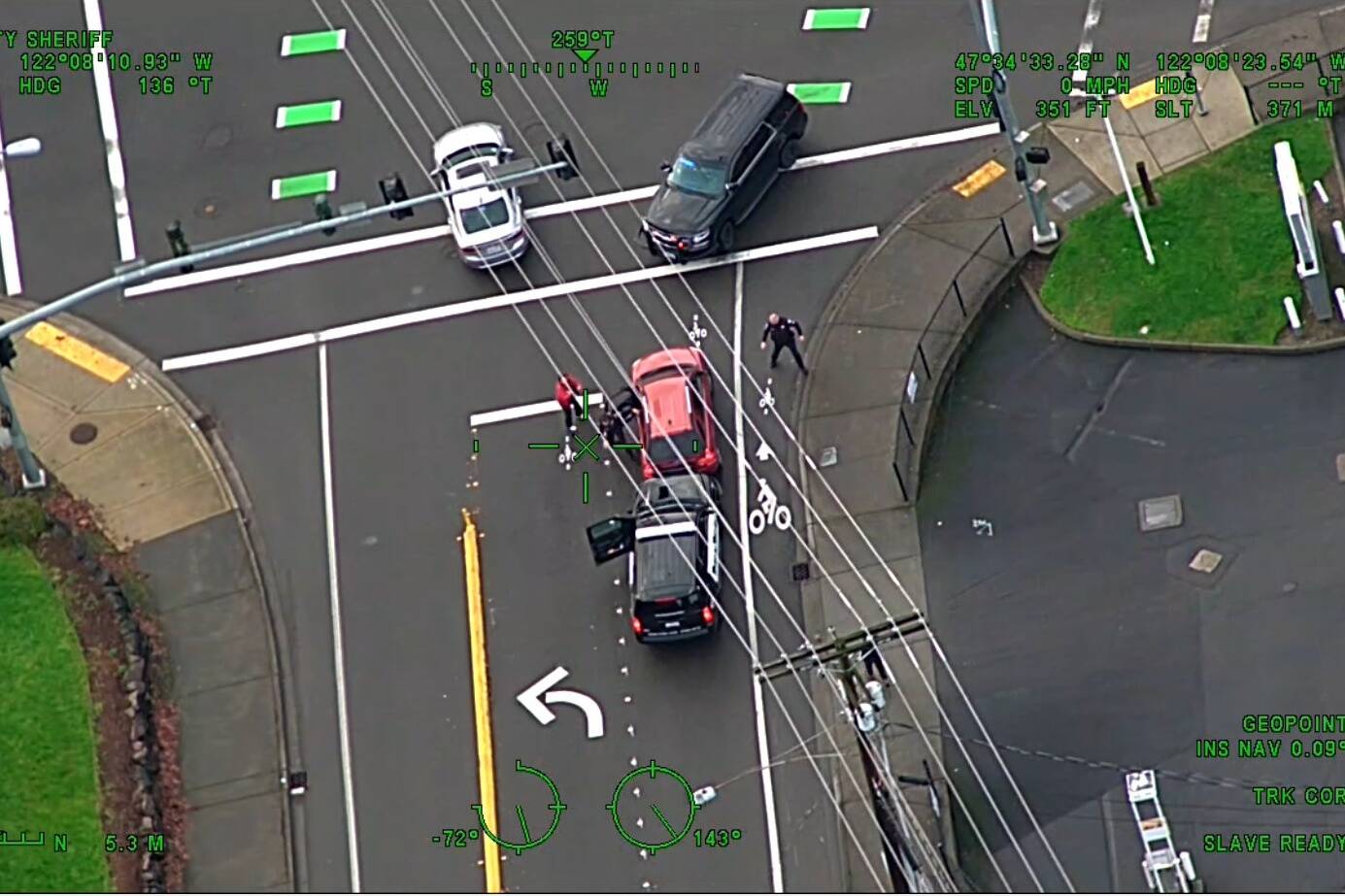 Guardian One footage from January 2022 shows an Issaquah police officer attempting to remove suspect from stolen vehicle but gets run over in the process. Courtesy of King County Sheriffs Office Air Support