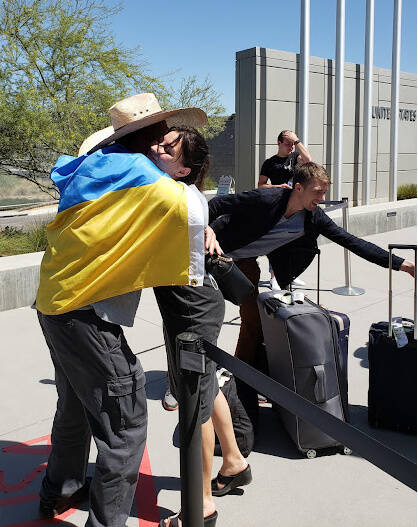 People embrace at the Mexico-United States border near San Diego. Courtesy of Matthew Smith