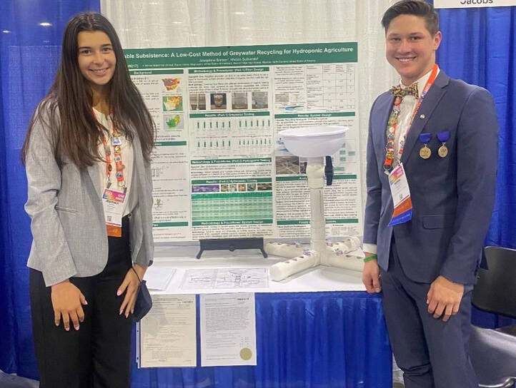 Mercer Islands Josephine Barber, left, stands with Mason Sufnarski of Waxhaw, North Carolina, while displaying their project, Sustainable Subsistence: A Low-Cost Method of Greywater Recycling for Hydroponic Agriculture, at the Regeneron International Science and Engineering Fair in Atlanta, Georgia. Courtesy photo
