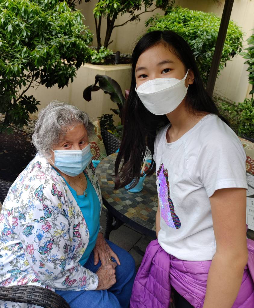 Janie Bianchi, left, and Sabrina Ha met for the first time at the May 24 pen pal party at the Aljoya assisted living community. Andy Nystrom/ staff photo