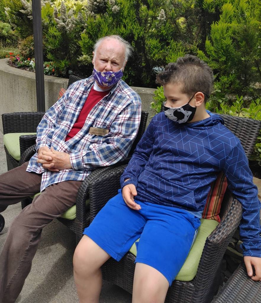 Pen pals Darrell Scattergood, left, and Ayden Wick visit on May 24 at the Aljoya assisted living community. Andy Nystrom/ staff photo
