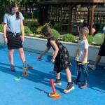 Northwest Yeshiva High School senior and Mercer Island resident Simone Sandorffy plays ring toss with Ukrainian orphans during a carnival in Neptun, Romania. Courtesy photo