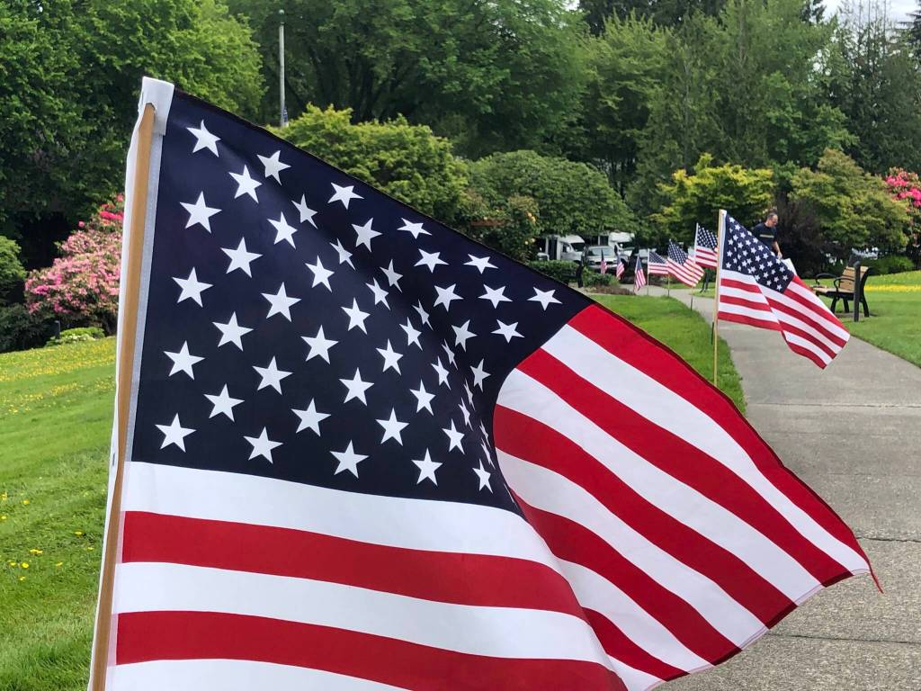 Covenant Living at the Shores on Mercer Island observes Memorial Day weekend each year by displaying several dozen flags throughout the campus. A team of residents plants the flags on driveways and walkways in honor of those who gave their lives to preserve the freedoms Americans enjoy. Courtesy of Greg Asimakoupoulos