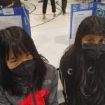 Left to right, Lakeridge Elementary School fifth-graders Lucy Hao and Anya Patel researched UNICEF (United Nations International Childrens Emergency Fund) and Action Against Hunger, respectively, for the Merchants with a Cause program. Andy Nystrom/ staff photo