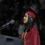 Graduate Nandini Rathod sings the National Anthem. Andy Nystrom/ staff photo
