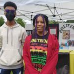 Mercer Island High School Black Student Union members Brooks Kahsai and LeaAsia Lane at the Juneteenth Festival Black culture fair on June 19 at Mercerdale Park. Andy Nystrom/ staff photo