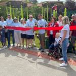 Mercer Island city officials take part in the ribbon-cutting ceremony for the newly renovated Mercerdale Park playground on July 9. Photo courtesy of Terry Lee