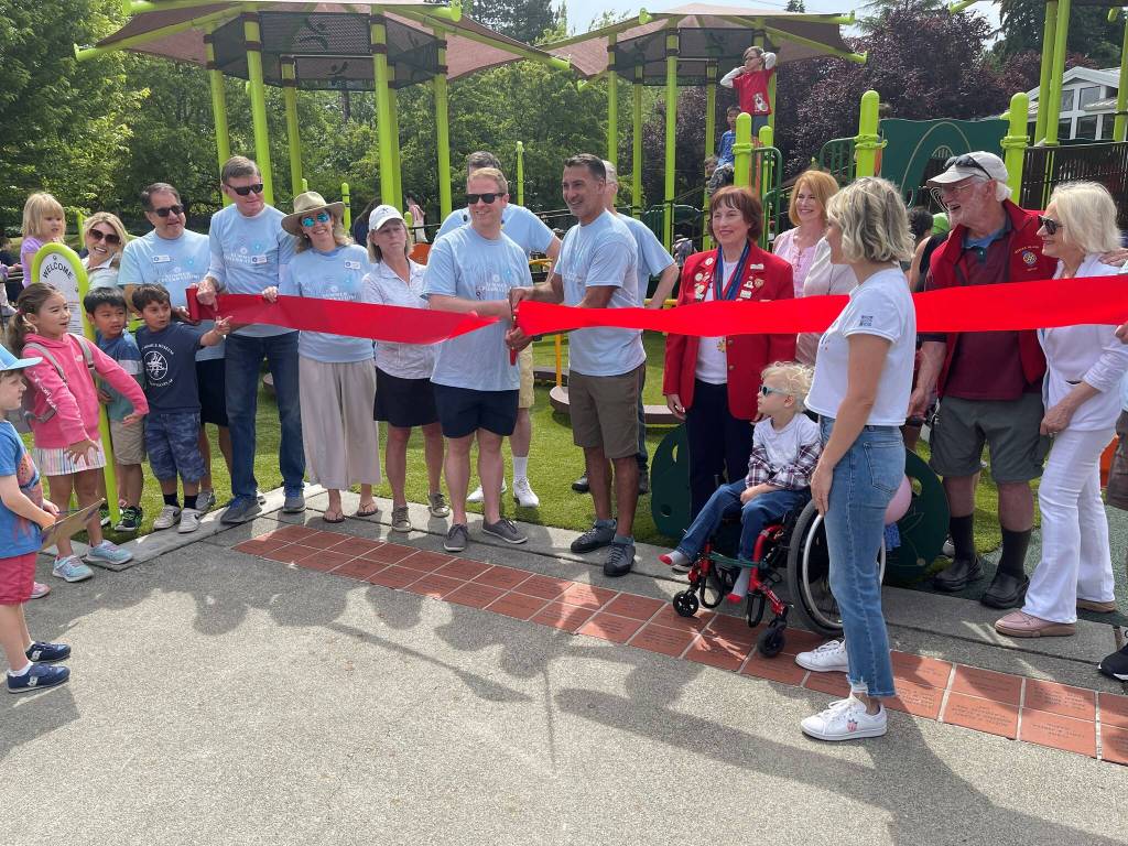Mercer Island city officials take part in the ribbon-cutting ceremony for the newly renovated Mercerdale Park playground on July 9. Photo courtesy of Terry Lee
