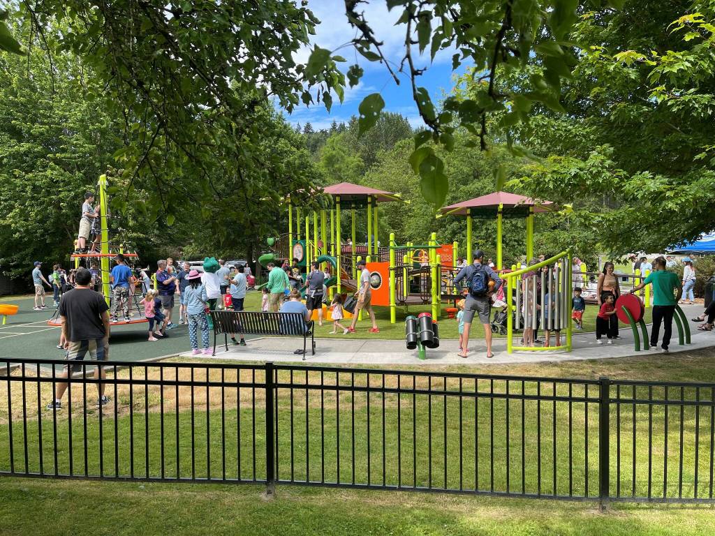 Children and adults get in some play time at the newly renovated Mercerdale Park playground on July 9. Photo courtesy of Terry Lee
