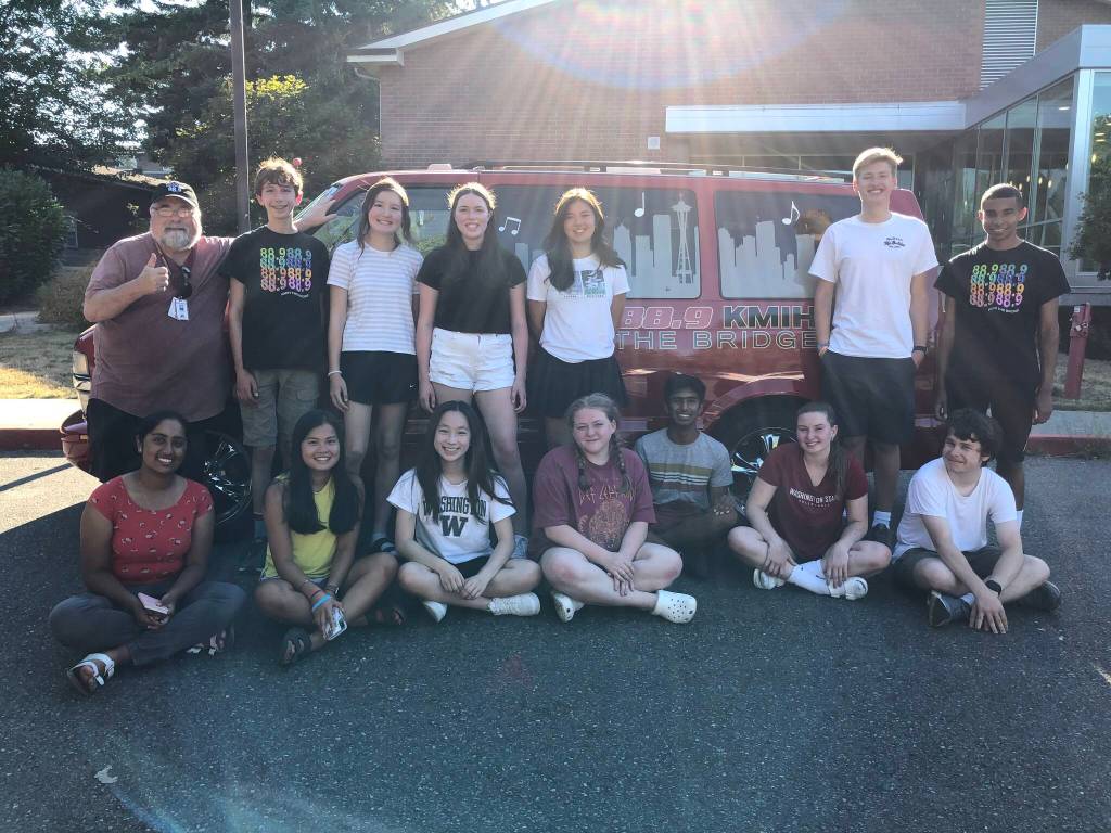 KMIH 88.9 The Bridge staff: Seated left to right  Amuktha Josyula, Hayley Nguyen, Chloe Yang, Ellie Sadlier, Sidh Shroff, Sophie Prock and Theodore Freeman. Standing left to right  Joe Bryant, Anatoly Odievich, Sophia Azzano, Annabelle Hegarty, Lauren Suzuki, Andrew Howison and Miles Avilez. Courtesy photo