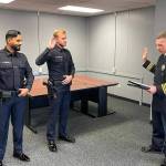 Officers Amandeep Shergill (left) and Reid Johnston (center) are the newest members of the Mercer Island Police Department force. They will now begin a three-month Field Training Officer (FTO) program where they will ride with, and learn from, several veteran officers. According to Chief Ed Holmes (right), when a new officer has successfully completed the FTO phase of their training, a patrol sergeant will serve as their mentor while they complete their probationary period. Photo courtesy of the Mercer Island Police Department
