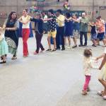 Attendees at the Rotary Club of Mercer Islands International Dance for Peace form a spontaneous conga line while children dance to live world music on Sept. 18 at the Mercer Island Community and Event Center. The event, which drew about 300 people and was billed as an All Island Dance Party, raised a significant amount of money to support international grants and humanitarian aid, including ones for Ukraine. Multiple Ukrainians who live on Mercer Island attended the event and met each other. The event replaced the Rotary half marathon, which had to be canceled due to COVID, and featured world music, a homemade-cookie table, a Drum Roll wine bar and multigenerational attendees from children to grandparents. The amount raised was not available at press time. To donate, visit <a href="http://www.mirotarydance.org" target="_blank">www.</a><a href="http://www.mirotarydance.org" target="_blank">mirotarydance.org</a>. Photo courtesy of John Hamer