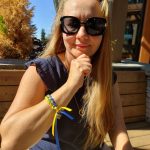 Nataliya Bobrovnyk sports a bracelet with blue and gold ribbons intertwined that signify the national colors of her native Ukraine. Andy Nystrom/ staff photo