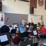 Mercer Island School District fifth-grade orchestra students run through their first lesson on Sept. 20, and several Mercer Island High School students also joined to assist students for the entire evening. Photo courtesy of the Mercer Island School District
