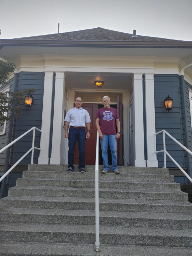 From left, Mercer Island VFW Post 5760 members Thomas Koger and Bob Harper stand outside the posts historic building. The structure was officially opened and dedicated on Oct. 21, 1922. Andy Nystrom/ staff photo