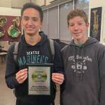 From left, Mercer Island High School wind ensemble trumpeters senior Sam Hill and junior Cameron Selby display the 2021-22 state level first-place award in the Mark of Excellence/National Wind Band Honors Project sponsored by The Foundation for Music Education. Photo courtesy of the Mercer Island School District