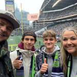 Victor Massicot and Eloi de Longchamp, center left and right, attend a Seattle Seahawks game on Oct. 30 with Natalie Debray and Stephan Debray. Courtesy photo