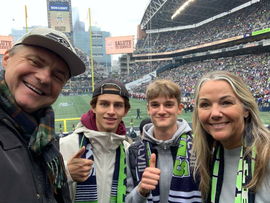 Victor Massicot and Eloi de Longchamp, center left and right, attend a Seattle Seahawks game on Oct. 30 with Natalie Debray and Stephan Debray. Courtesy photo