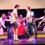 Mercer Island High School Grease cast members roll through a dress rehearsal. Photo courtesy of Greg Chvany