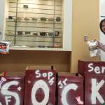 Mercer Island High School robotics team members Alanna Larson and Noah Do collect socks for Operation Nightwatch. Courtesy photo