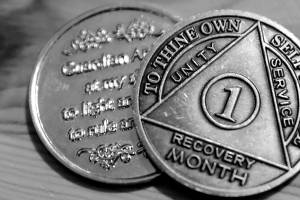 One persons month recovery coins after battling a fentanyl addiction. (Kevin Clark / The Herald)