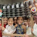 Students join together for a photo at the Korean family table. (Photos courtesy of Soyun Chow)