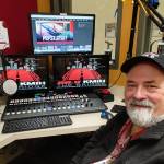 Joe Bryant sits in the broadcasting booth of Mercer Island High Schools KMIH 88.9 The Bridge. Andy Nystrom/ staff photo