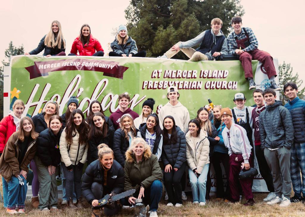 Mercer Island High School members of Mercer Trade, Inc. and their instructors gather at the Mercer Island Community Holiday Tree Lot. Courtesy photo