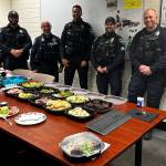 An appreciative community group recently delivered a Christmas meal to the Mercer Island Police Department. Courtesy photo
