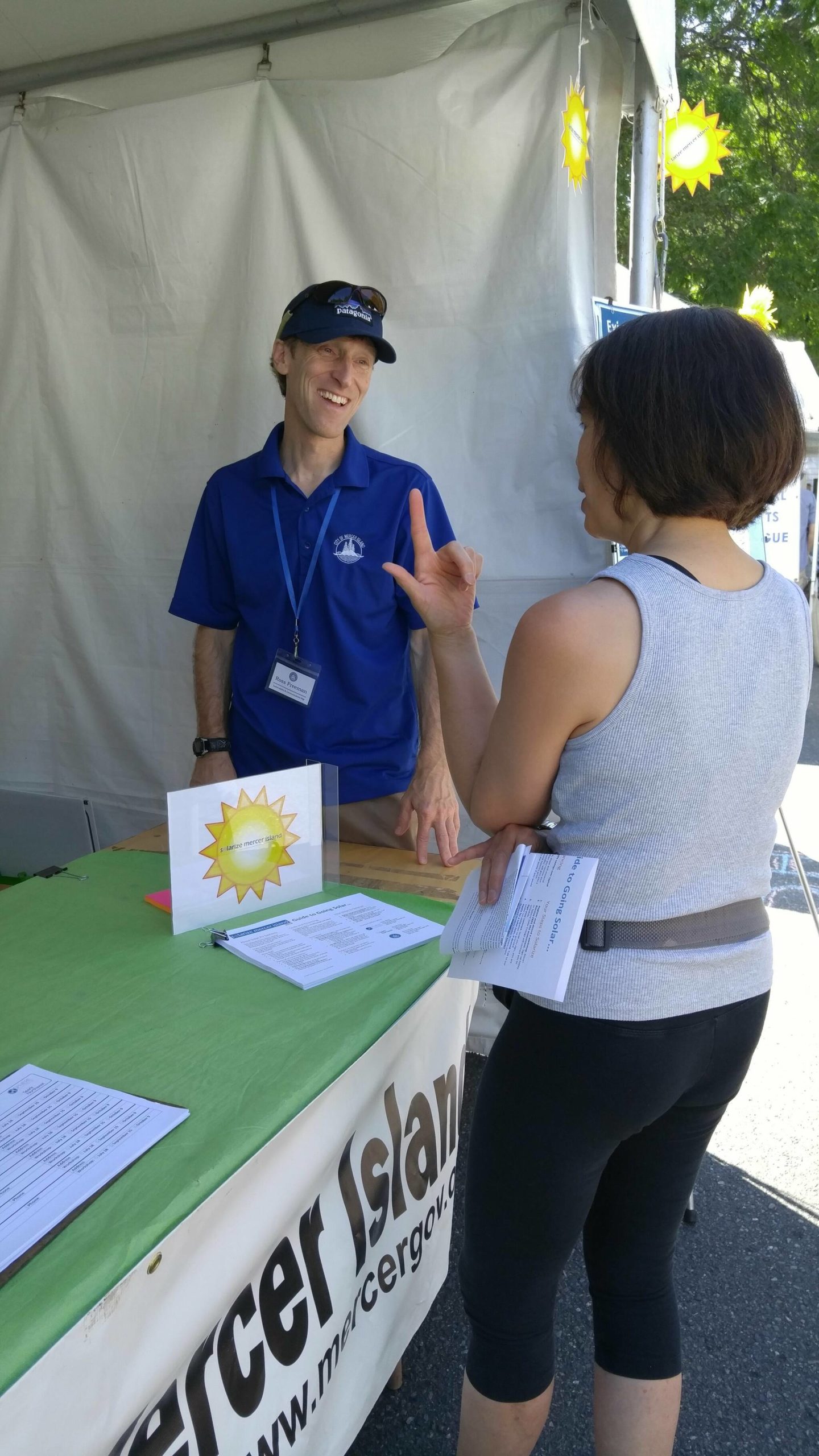 Courtesy photo
Ross Freeman, the city of Mercer Islands sustainability program analyst, chats with an attendee at the 2018 Summer Celebration.
