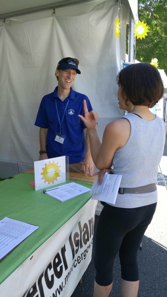 Courtesy photo
Ross Freeman, the city of Mercer Islands sustainability program analyst, chats with an attendee at the 2018 Summer Celebration.