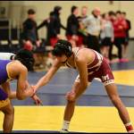 Mercer Island High Schools Chase Warnick, right, prepares to battle an opponent on the wrestling mat this season. Photo courtesy of Aaron Koopman
