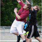 A Mercer Island High School ultimate player and an opponent reach for the disc during a match from a past season. Courtesy photo