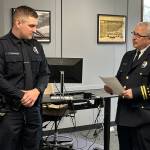 New Mercer Island Police Department officer Jordan Tranter graduated from the law enforcement academy and was sworn in by commander Jeff Magnan on Feb. 6 as police chaplain Greg Asimakoupoulos looked on. The chaplain was a college classmate of Tranters father 50 years ago. Photo courtesy of Greg Asimakoupoulos