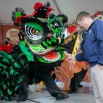 Photo by Ryan Berry / The Herald
Edmonds Mayor Mike Nelson rewards a lion dancer with a traditional red envelope during a celebration of the Lunar New Year on Saturday, Jan. 21, 2023.