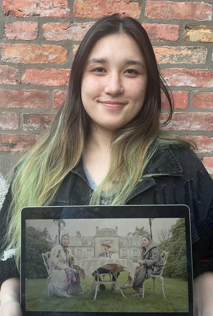 Mercer Islander Alex Isbell, who received a 2023 YoungArts competition prestigious finalist award for her short film, JAccucumber, a World War II narrative absurdist satire. Here, she displays a still shot from the film. Courtesy photo