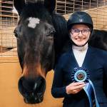 Mercer Island High School freshman Harper Hood placed first at the recent Interscholastic Equestrian Association (IEA) Zone 9 Hunt Seat competition in Lynden. With the win, she advances to the national finals at the Tryon International Equestrian Center in Tryon, North Carolina, from April 26-30. At the unique IEA showings at the local, regional, zone and national levels, riders draw their horses instead of bringing their own. Photo courtesy of the Mercer Island School District