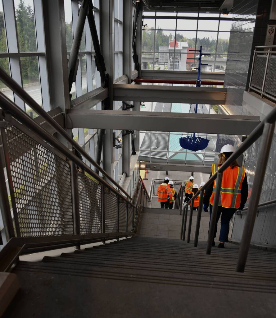 Tour attendees descend one of the staircases at the Mercer Island Station of the East Link Extension Project on May 1. Andy Nystrom/ staff photo