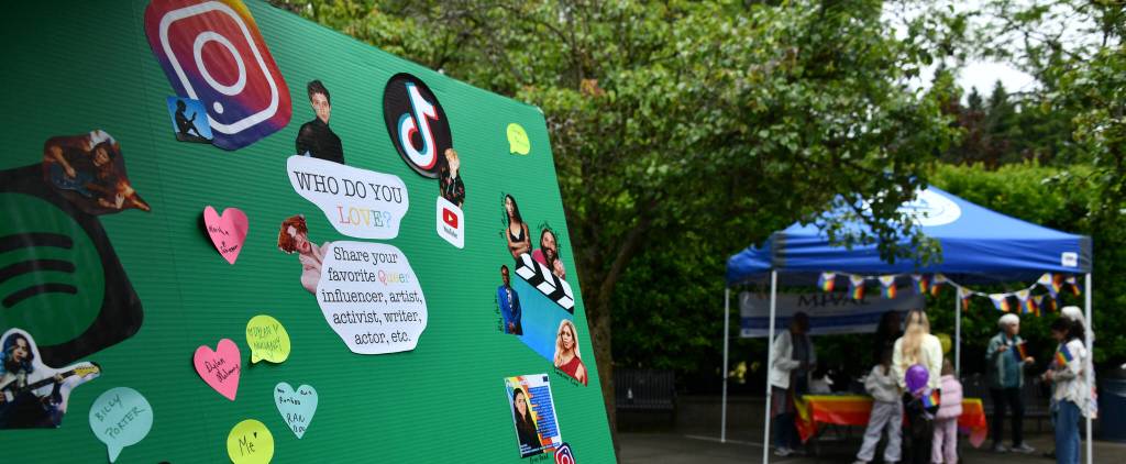 Pictured is a board where kids shared their favorite LGBTQ influencer, artist, activist or writer. The Mercer Island Visual Arts League booth is on the right. Andy Nystrom/ staff photo