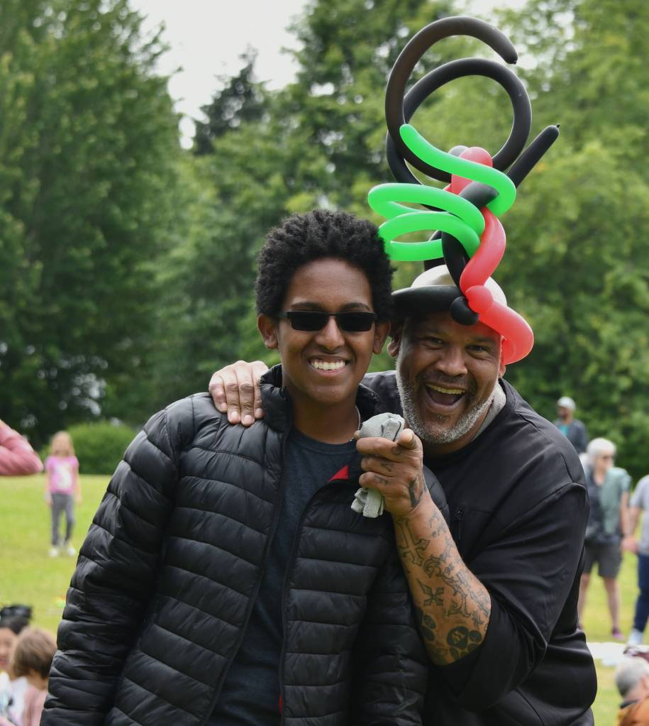 Mercer Island High School Black Student Union member and president-to-be Tewodros (Teddy) Sanchez-Alemu and adviser Kelly John-Lewis enjoy the Juneteenth Community Celebration that took place from noon to 4 p.m. on June 19 at Mercerdale Park. Andy Nystrom/ staff photo