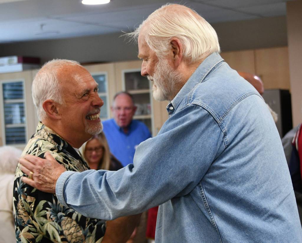 Chaplain Greg Asimakoupoulos, left, chats with Dick Sundholm at the chaplains retirement celebration on June 21 at Covenant Living at the Shores on Mercer Island. Andy Nystrom/ staff photo