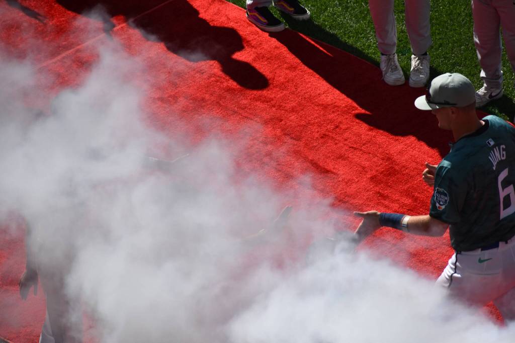 Texas Rangers rookie Josh Jung giving kids a high five on his way out to represent the American League. Ben Ray / The Mirror
