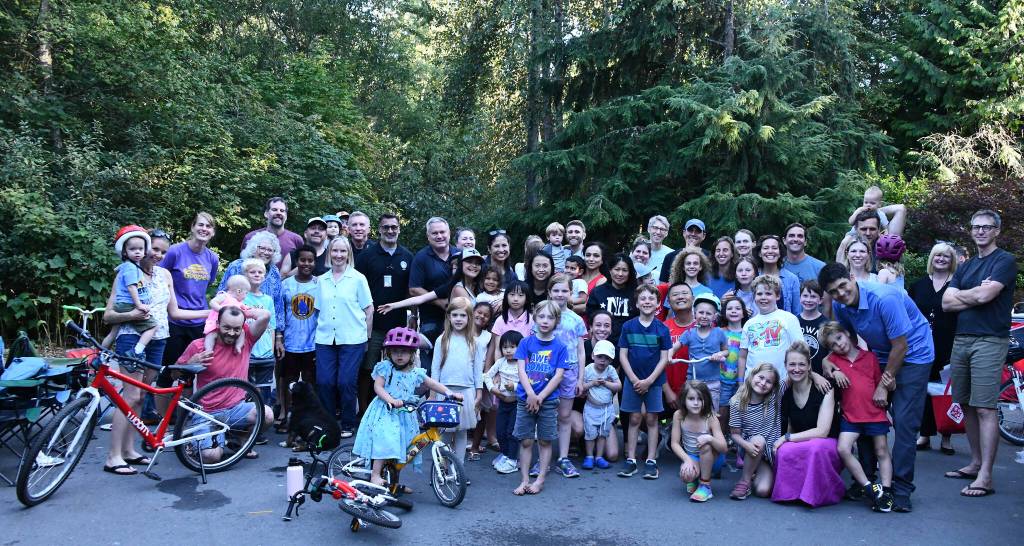 Mercer Islanders gather in the Ellis Pond neighborhood along with Mayor Salim Nice, Mercer Island Police Department Chief Ed Holmes and the citys emergency management leader Amanda Keverkamp at a National Night Out gathering on Aug. 1. Islander Jordan Naftolin organized this robust event in his area. The national campaign promotes police-community partnerships and focuses on crime prevention and resident connectedness. Story to come. Andy Nystrom/ staff photo
