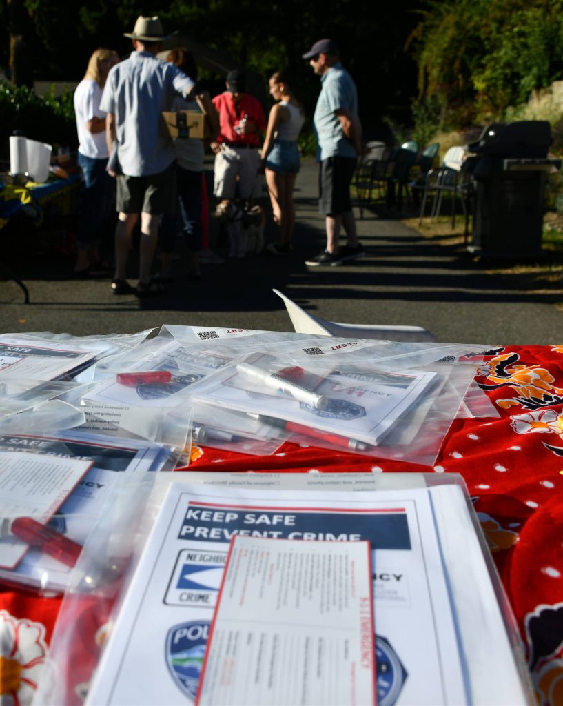 Mercer Islands emergency management leader Amanda Keverkamp distributed these crime-prevention kits prior to National Night Out gatherings. Pictured is Tana Senns event. Andy Nystrom/ staff photo