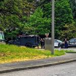 Police officers survey the scene at the intersection of East Mercer Way and Southeast 36th Street on Mercer Island where an abandoned gunshot-damaged motorhome was located on Aug. 8. Photo courtesy of the Mercer Island Police Department
