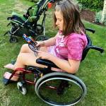 Charlotte Hawkins looks at a photo of Aidan Leung, her beloved Mercer Island High School classmate who passed away last year. Courtesy photo