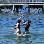 Islanders Arin Agarwal, left, and Remy Frederick battle for the ball thrown by Pete Pratt amidst the scorching heat on Aug. 15 at Groveland Beach Park off Lake Washington. The weather reached 93 degrees on the day. Andy Nystrom/ staff photo