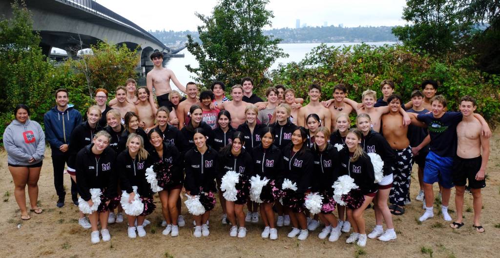 Mercer Island High School boys water polo team members gather with their coaches and the schools cheerleaders on Aug. 29. Courtesy photo